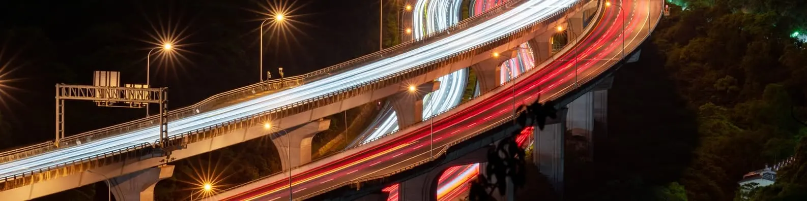 Nighttime Urban Flyover Background