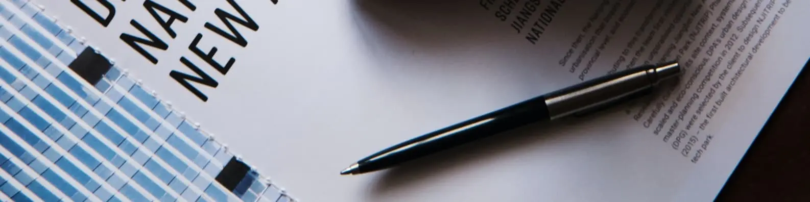 Pen on Book – Mightier Than a Sword Background